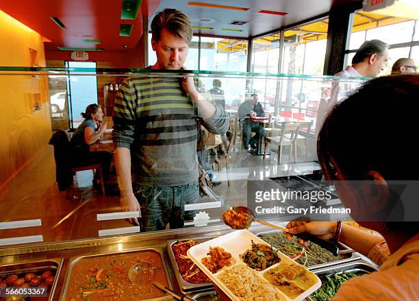 Matt Ronchetti orders the combination plate for $7.99 from the Samosa House which is located at 10700 Washington Blvd. In Culver City. It has jack...