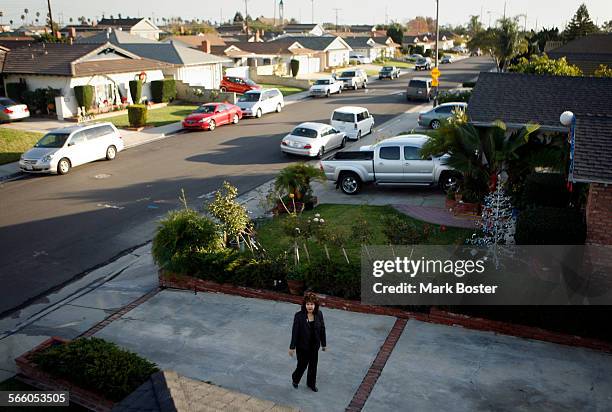 Rosemary Naval walks up her driveway on Panama Avenue in Carson . However, she and her husband Rudy are living a nightmare in the home that they...