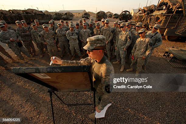 1st Lt. Robert Fenoglio briefs his men on the departure from Iraq. Members of the 4th Stryker Brigade Combat Team, 2nd Infantry Division led by Col....