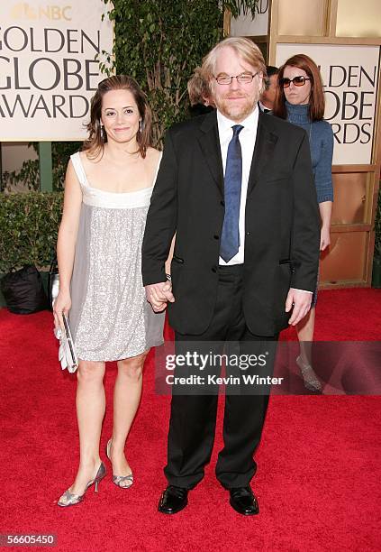 Actor Philip Seymour Hoffman and guest arrive to the 63rd Annual Golden Globe Awards at the Beverly Hilton on January 16, 2006 in Beverly Hills,...