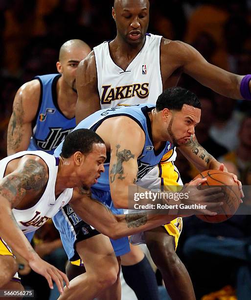 Lakers guard Shannon Brown rips the ball from Jazz guard Deron Williams as Lamar Odom looks on in the first half of game one of the NBA Western...