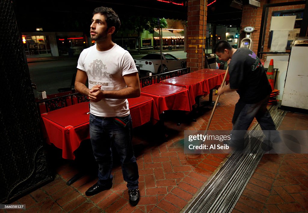 Hamad Hemila Almazrouei, 20, watches Al Jazeera broadcast President Obama's speech live from Egypt