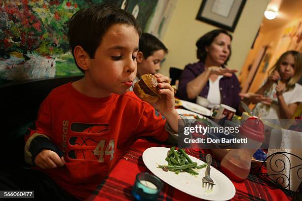 Yrold Aidan Manning manages dinner using only his left hand. The boy lost the use of his other arm and suffers developmental impairments because of...