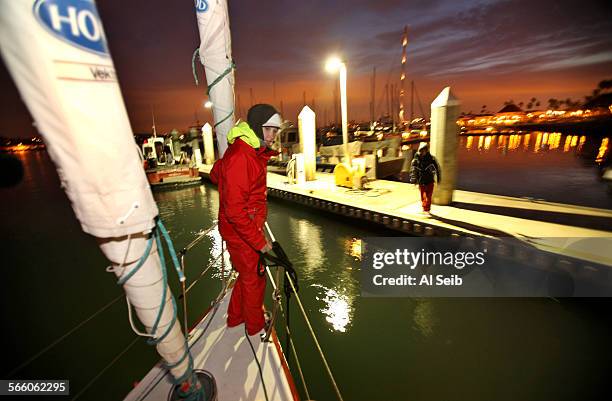 Abby Sunderland prepares to throw the line to her older brother Zac waiting on the customs dock in San Diego after a long 18 hour journey with her...