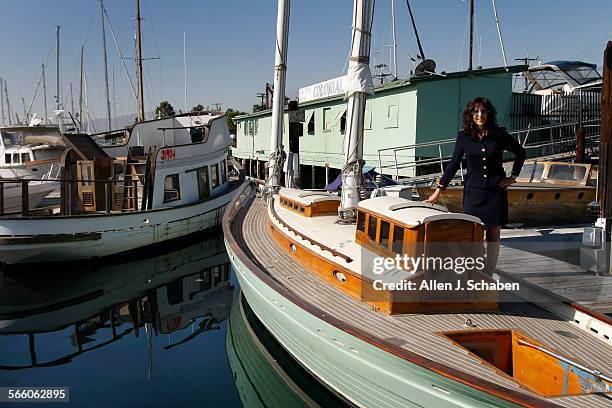 Maria Camello stands aboard a 40foot ketch her family business restored and is for sale at the familyowned Colonial Yacht Anchorage business in...