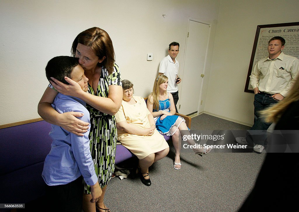 Melissa Huckaby's aunt Joni Hughes, embraces her son Cooper after Easter services at Clover Road Ba