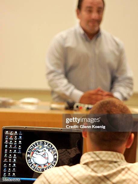 Veteran Andy Chavez Jr. Had a USMC logo on his computer while listening to Ed Ceja, CEO Digital International Corp. Teach a session at the...