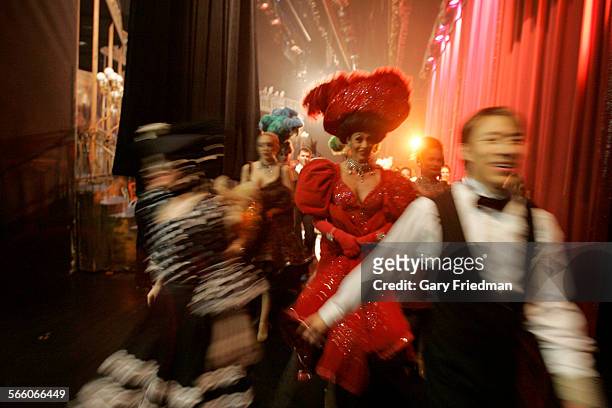 Dancers leave the stage following the "Can Can" number of the Folies Bergere at the Tropicana Hotel in Las Vegas on March 2, 2009. . The Folies is...