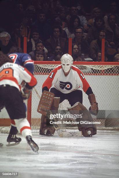 Canadian professional hockey player Bernie Parent, goalie for the Philadephia Flyers, guards the net during a home game, Philadelphia, Pennsylvania,...
