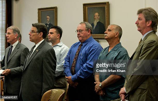 June 16, 2008.  Mark Leggio, left, hidden behind attorney, Nick Cacucciolo, James Deremiah, and Nicola Cacucciolo, named in a 37 count...