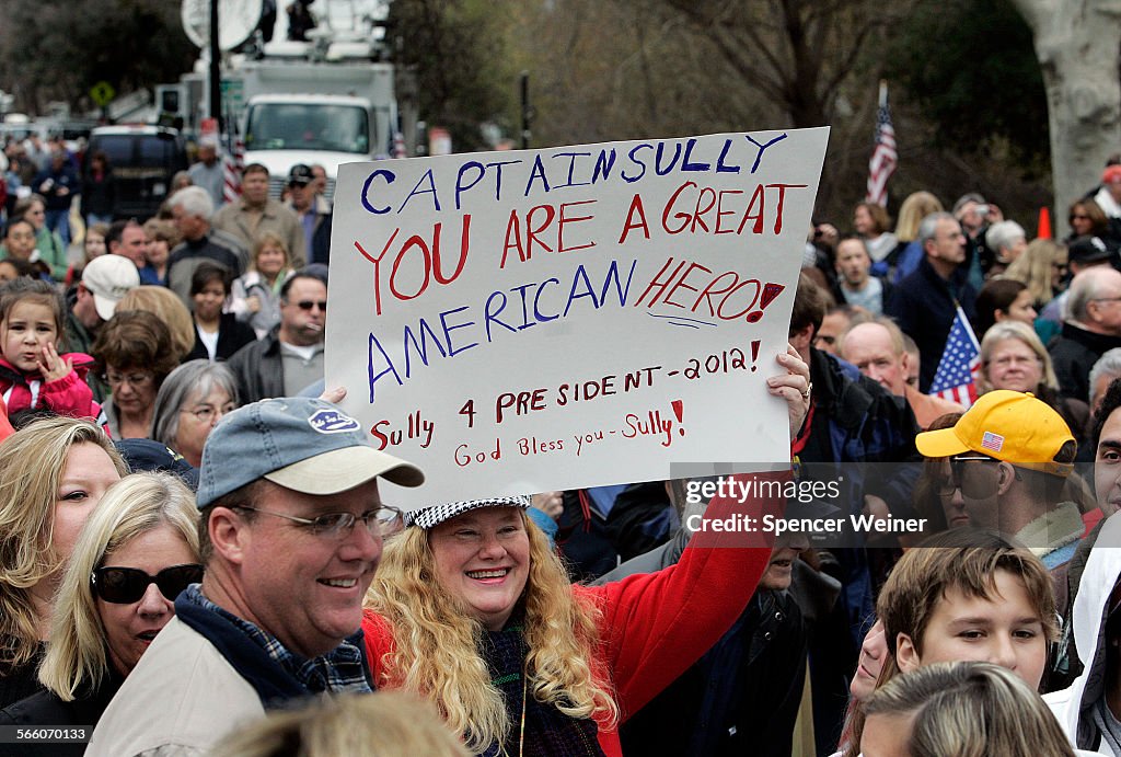 Susan Fleming, holds a sign proclaiming a common sentiment, january 24, 2009. More than one thousan