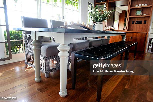 Dining table with traditional wooden legs and a modern zinc top mix in dining area of Claire Stansfield's recently remodeled Hollywood Hills home...