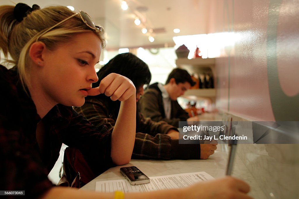 Bronte Cox,18, left, from Van Nuys, Bernice Rivera,17, from Panorama City, and Walter Donley,18, fr