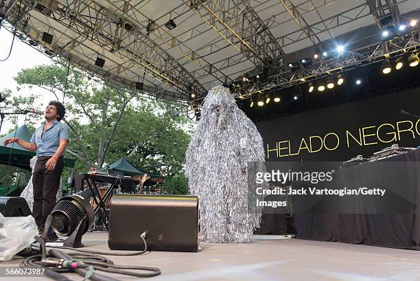 American musician Helado Negro performs onstage, with a costumed dancer, during a concert at the 16th Annual Latin American Music Conference series...