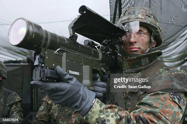 Member of the German Lutfwaffe holds a Stinger anti-aircraft missile launcher in a capabilities demonstration during the visit of German Defense...