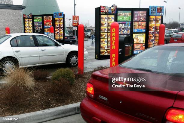 Vehicles in two separate drive-up lanes place orders at a McDonald's drive-thru location January 17, 2006 in Rosemont, Illinois. McDonald's,...