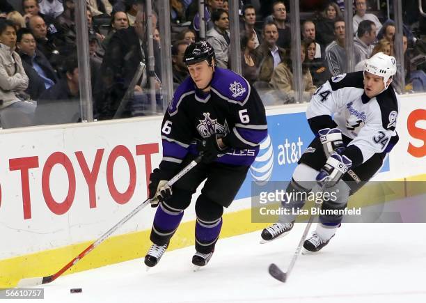 Joe Corvo of the Los Angeles Kings carries the puck under pressure from Ryan Craig of the Tampa Bay Lightning on January 17, 2006 at Staples Center...