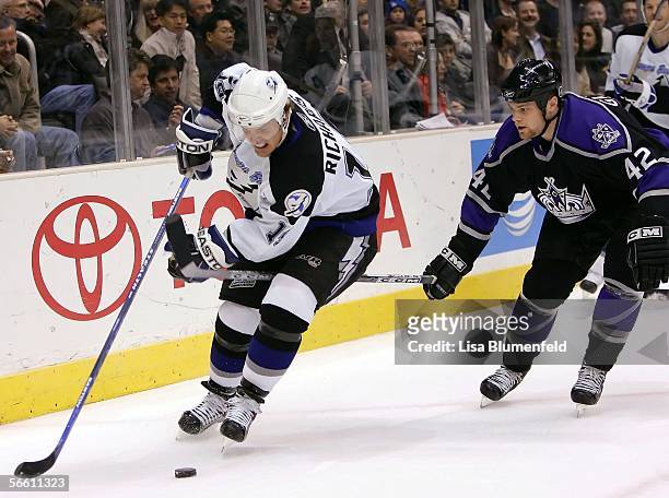 Brad Richards of the Tampa Bay Lightning carries the puck under pressure from Tim Gleason of the Los Angeles Kings on January 17, 2006 at Staples...