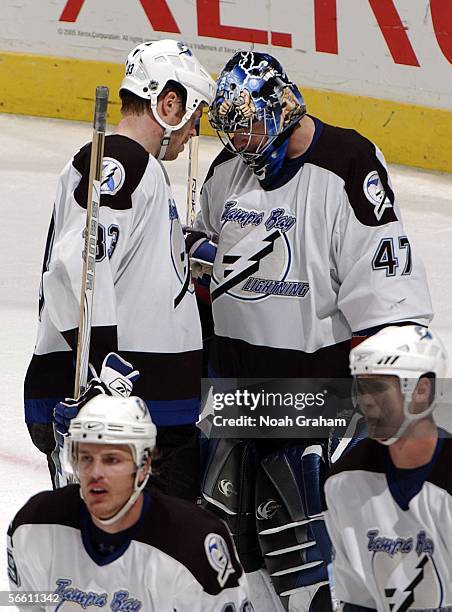 John Grahame of the Tampa Bay Lightning is congratulated by teammate Fredrik Modin after the win against the Los Angeles Kings on January 17, 2006 at...