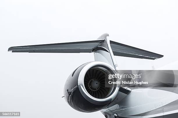 tail and turbine engine of private jet - jet engine stock pictures, royalty-free photos & images