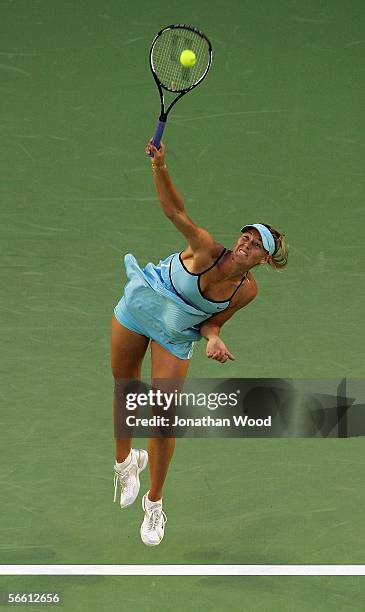 Maria Sharapova of Russia serves in her second round match agfainst Ashley Harkleroad of the USA during day three of the Australian Open at Melbourne...