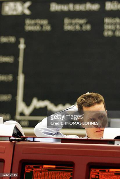 Germany: A trader sits in front of a chart displaying German share index DAX gestures 18 January 2006 at the stock exchange in Frankfurt/M. The DAX...