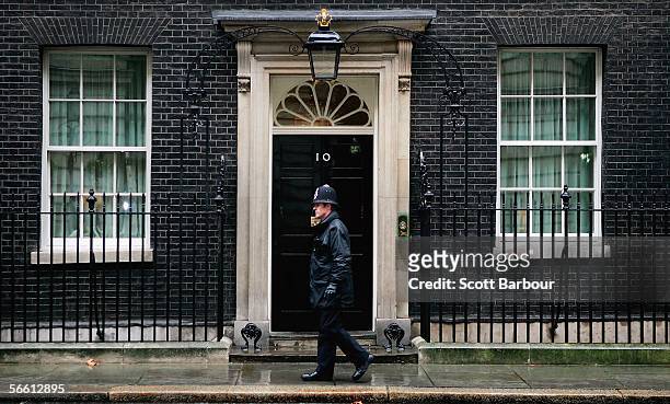 Police officer patrols outside of the official residence of Britain's Prime Minister Tony Blair at Downing Street on January 18, 2006 in London,...