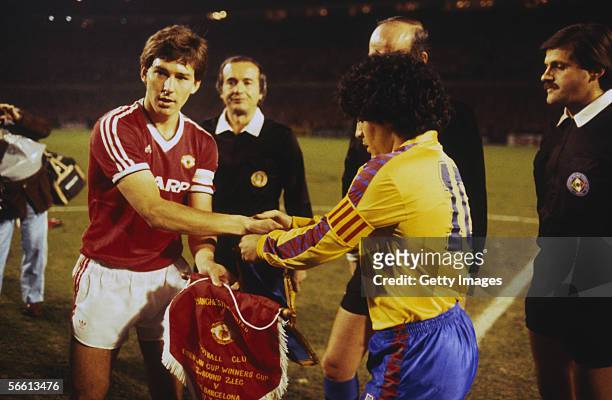 Captain Bryan Robson of Manchester United shakes hands with Barcelona captain Diego Maradona before the European Cup Winners Cup Quarter-Final Second...