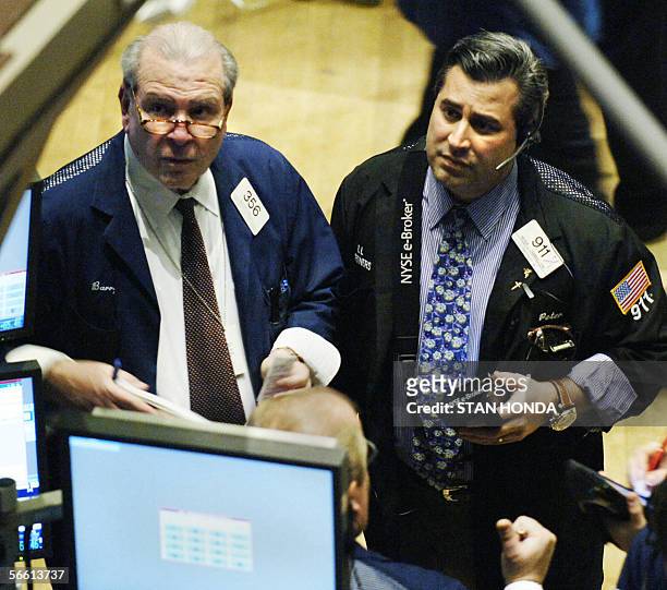New York, UNITED STATES: Two traders watch prices on the floor of the New York Stock Exchange, 18 January just after the opening bell. Stocks in New...