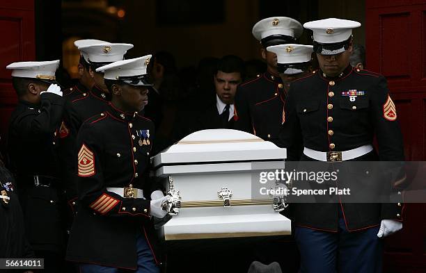 Marines carry body of Nixzmary Brown out to a hearse after her funeral January 18, 2006 in New York City. Brown was found beaten to death last week...