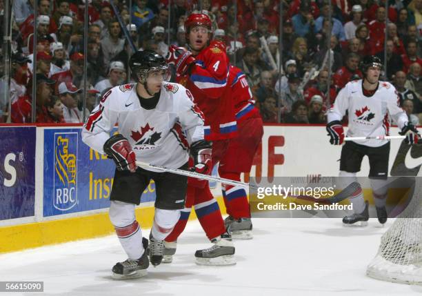 Andrew Cogliano of Team Canada skates against Nikita Nikitin of Team Russia during the gold medal game at the World Junior Hockey Championships at...
