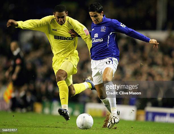 Marvin Elliott of Millwall holds off Tim Cahill of Everton during the FA Cup Third Round Replay match between Everton and Millwall at Goodison Park...