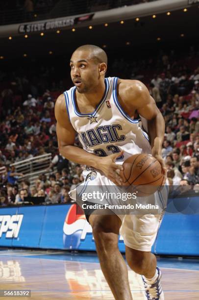 Grant Hill of the Orlando Magic drives to the basket against the New Jersey Nets during a game at TD Waterhouse Centre on December 21, 2005 in...