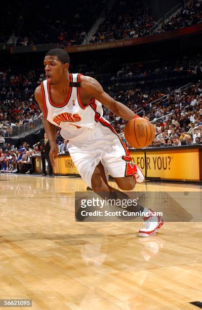 Joe Johnson of the Atlanta Hawks drives by the Detroit Pistons on January 18, 2006 at Philips Arena in Atlanta, Georgia. NOTE TO USER: User expressly...