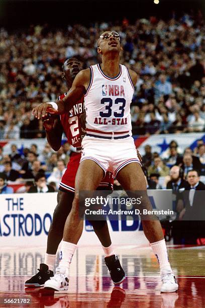 Kareem Abdul-Jabbar of the Western Conference All-Stars boxes out Michael Jordan of the Eastern Conference All-Stars during the 1989 NBA All-Star...