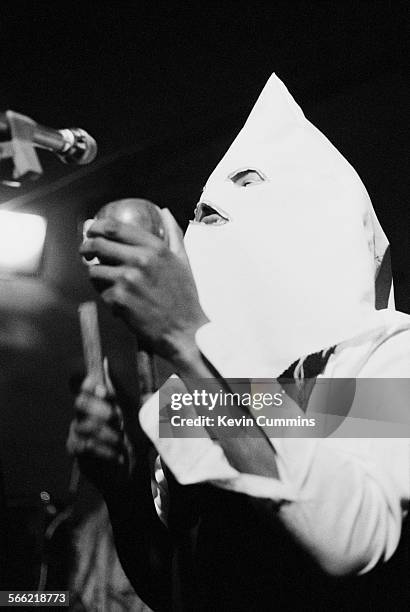 Singer David Hinds performing, in a Ku Klux Klan hood, with English roots reggae band Steel Pulse at the Electric Circus, Manchester, 1st October...