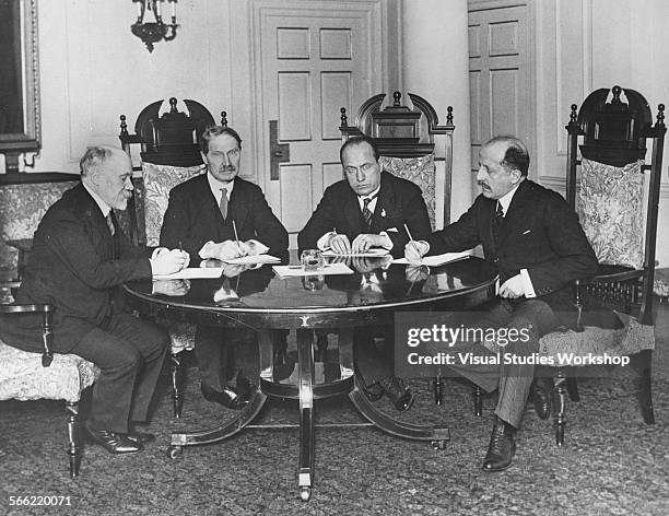 Europe's 'Big Four' are seen gathered around the table at 10 Downing Street at their first meeting to discuss the German Reparation and the...
