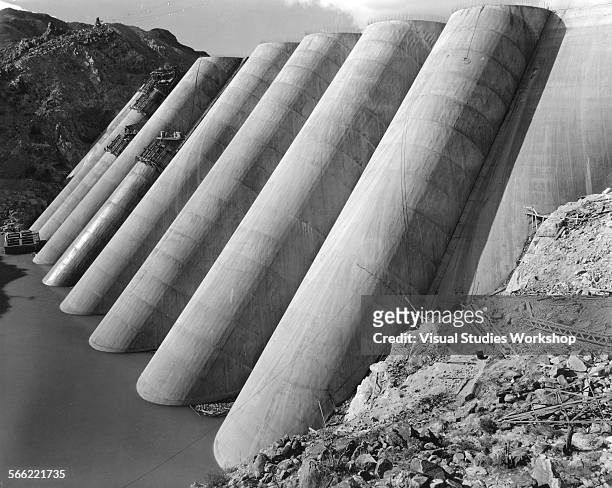 Storage of the Verde River begins behind the multiple arches of the Bartlett Dam, a 270-foot dam that will be the highest of its type in the world,...