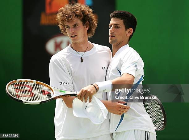 Andy Murray of Great Britain and Novak Djokovic of Serbia and Montenegro celebrate a point in their doubles match against Fabrice Santoro of France...