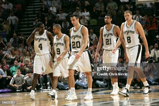 Michael Finley, Tony Parker, Manu Ginobili, Tim Duncan and Rasho Nesterovic of the San Antonio Spurs take a timeout against the Milwaukee Bucks on...