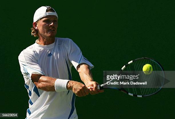 Alex Bogomolov Jr. Of the USA hits a backhand in his second round match against Paul-Henri Mathieu of France during day four of the Australian Open...