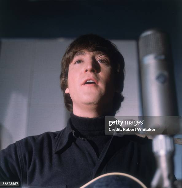 Beatles singer John Lennon during a recording studio session.