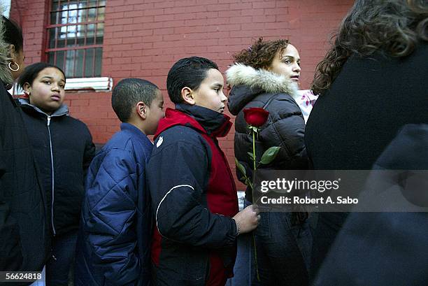 Schoolmates of Nixzmary Brown, Francisco Minier and Pablo Deleon wait to pay their respects at the Ortiz Funeral Home January 16, 2006 in New York....