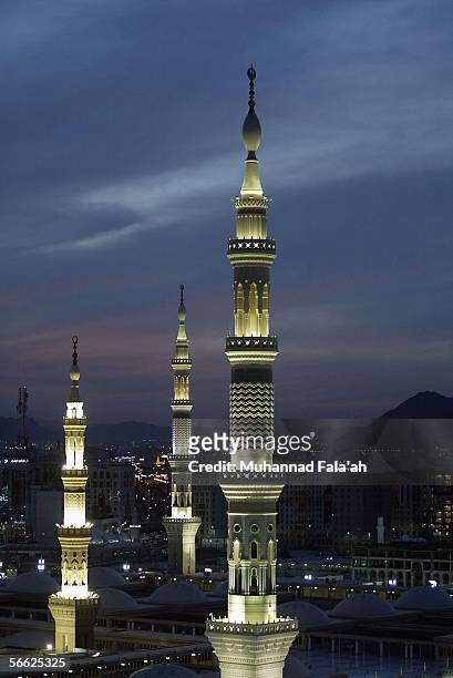 The minarets of the Prophet Muhammad mosque are lit up on January 19, 2006 in the holy city of Medina, Saudi Arabia. Saudi authorities are turning...