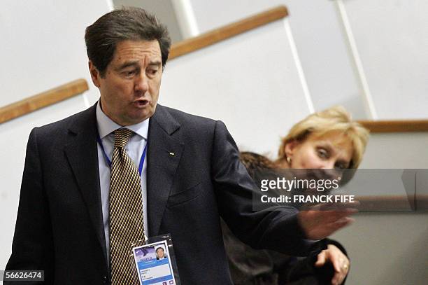 Ottavio Cinquanta, the president of the International skating union, gestures in the stands before the start of the Ladies Free Skating competition...