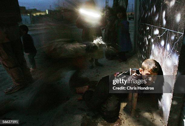 Rakan Hassan, then 11, is treated by a medic seconds after being accidentally shot by U.S. Soldiers January 18, 2005 in Tal Afar, Iraq. Racan's...