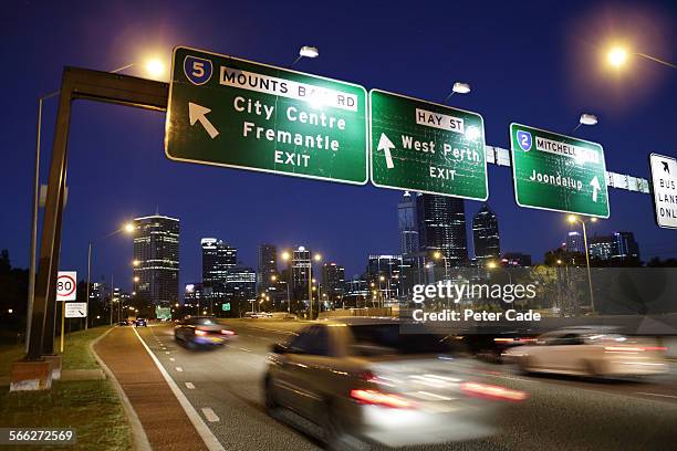 busy highway in city at night , city of perth . - perth australia stock pictures, royalty-free photos & images