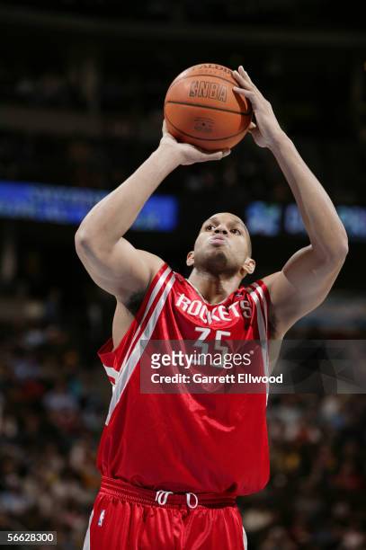 Lonny Baxter of the Houston Rockets shoots a free throw against the Denver Nuggets on December 23, 2005 at the Pepsi Center in Denver, Colorado. The...