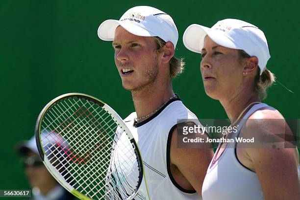 Nathan Healey of Australia and Trudi Musgrave of Australia talks tactics in their doubles match against Jim Thomas of the USA and Bryanne Stewart of...