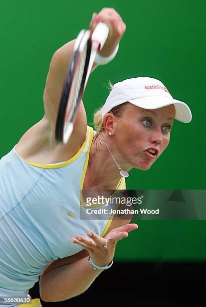 Bryanne Stewart of Australia serves in her doubles match with Jim Thomas of the USA against Trudi Musgrave and Nathan Healey of Australia during day...